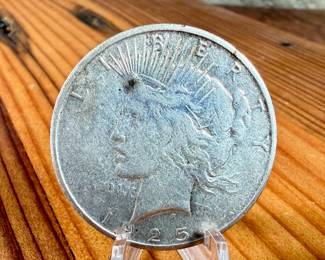 This lot features a 1925-S Peace Dollar.