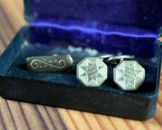 This lot features an antique cufflink set with a beautiful design and held in an antique case.