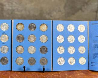 This lot features a beautiful collection of Kennedy half dollars, displayed in a Whitman folder. There are a total of thirty-six (36) Kennedys. 
