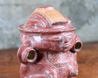 This lot features a pre-columbian style effigy vessel in good overall condition that measures, 10” H x 8” W x 7” D.