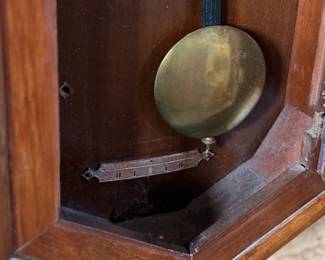 This lot features a Seth Thomas “World” model long-drop schoolhouse clock from the late 19th century.  It features a distinctive octagonal top and a long lower case for the pendulum. Tested and in good working condition with key. Measures, 32” H x 17” W.