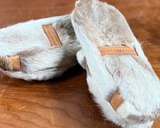 These reindeer fur slippers feature traditional Sami-style colorful decorative detailing on the front and measure, 9” heel to toe.