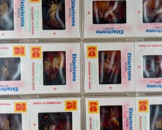 Vintage 35mm slides primarily organized in a transparent holder. Each slide features labels with the name “Richard Creamer” and addresses in Beverly Hills and Los Angeles, CA. Subjects documented include notable music acts such as Seals & Crofts and Donna Summer.