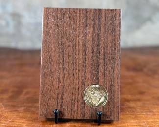 This lot features a 1971 United States Mint Eisenhower “Brown Box” Proof Dollar, which is a collectible numismatic coin. The coin is struck in a 40% silver composition.