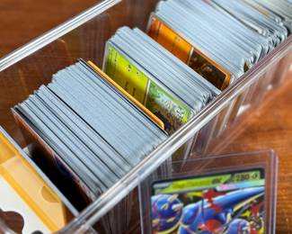 This lot features a large Pokemon trading card collection full of holos, bulk, ex cards, full art, and more. Some Japanese & Korean cards included too!