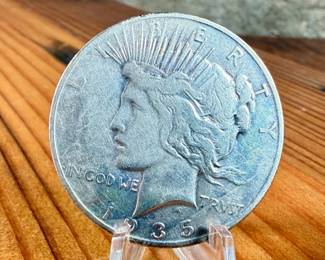 This lot features a 1935-S Peace Dollar.