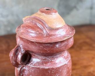 This lot features a pre-columbian style effigy vessel in good overall condition that measures, 10” H x 8” W x 7” D.