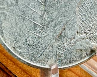 This lot features a 1925-S Peace Dollar.
