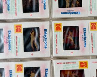 Vintage 35mm slides primarily organized in a transparent holder. Each slide features labels with the name “Richard Creamer” and addresses in Beverly Hills and Los Angeles, CA. Subjects documented include notable music acts such as Seals & Crofts and Donna Summer.