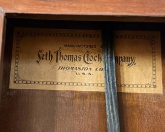 This lot features a Seth Thomas “World” model long-drop schoolhouse clock from the late 19th century.  It features a distinctive octagonal top and a long lower case for the pendulum. Tested and in good working condition with key. Measures, 32” H x 17” W.