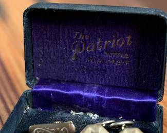 This lot features an antique cufflink set with a beautiful design and held in an antique case.
