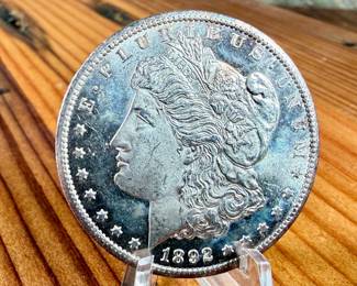 This lot features a 1892-CC Morgan Dollar. Carson City!