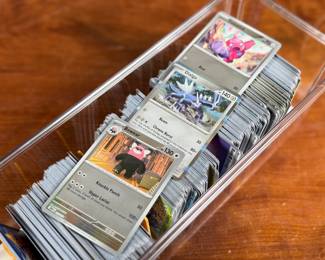 This lot features a large Pokemon trading card collection full of holos, bulk, ex cards, full art, and more. Some Japanese & Korean cards included too!