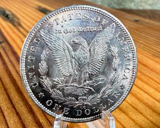 This lot features a 1892-CC Morgan Dollar.