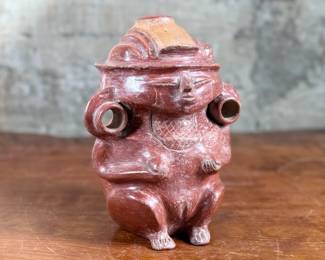 This lot features a pre-columbian style effigy vessel in good overall condition that measures, 10” H x 8” W x 7” D.