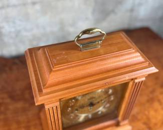 This lot features an Emperor Mantel Clock in good working condition with a key. This clock measures, 15” H x 11” W x 6” D. Franz Hermle two (2) jewel movement.