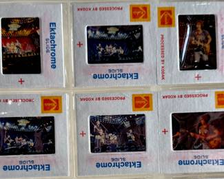 Vintage 35mm slides primarily organized in a transparent holder. Each slide features labels with the name “Richard Creamer” and addresses in Beverly Hills and Los Angeles, CA. Subjects documented include notable music acts such as Seals & Crofts and Donna Summer.