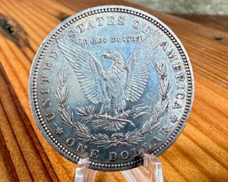 This lot features a 1879 Morgan Dollar.