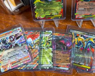 This lot features a large Pokemon trading card collection full of holos, bulk, ex cards, full art, and more. Some Japanese & Korean cards included too!