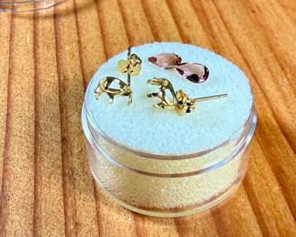 This lot features a pair of (.80 carats) tourmaline gemstones and a set of 14k gold earrings to fit them.