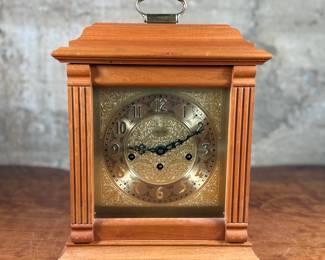 This lot features an Emperor Mantel Clock in good working condition with a key. This clock measures, 15” H x 11” W x 6” D. Franz Hermle two (2) jewel movement.