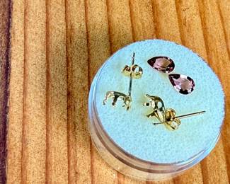 This lot features a pair of (.80 carats) tourmaline gemstones and a set of 14k gold earrings to fit them.
