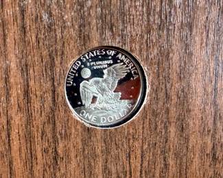 This lot features a 1971 United States Mint Eisenhower “Brown Box” Proof Dollar, which is a collectible numismatic coin. The coin is struck in a 40% silver composition.