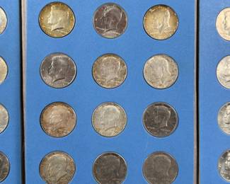 This lot features a beautiful collection of Kennedy half dollars, displayed in a Whitman folder. There are a total of thirty-six (36) Kennedys. 