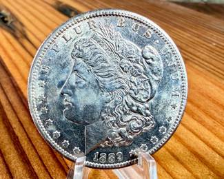This lot features a 1889-S Morgan Dollar.