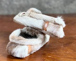 These reindeer fur slippers feature traditional Sami-style colorful decorative detailing on the front and measure, 9” heel to toe.