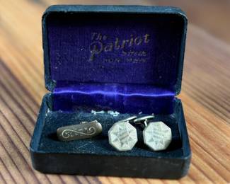 This lot features an antique cufflink set with a beautiful design and held in an antique case.