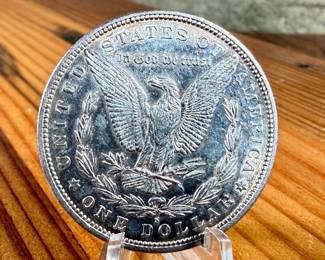 This lot features a 1887-S Morgan Dollar.