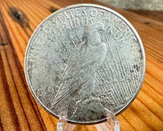 This lot features a 1925-S Peace Dollar.