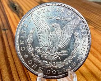 This lot features a 1880-S Morgan Dollar.