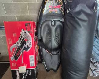 Obrien Black Magic Wake Board, punching bag and gloves, Brutus tile cutter.