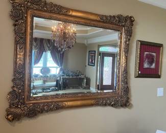 #29	Ornate Gold Framed Beveled Mirror (56w x 45h)	 $125.00 
