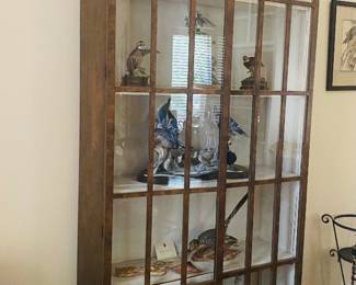 Tall, low profile glass case with plate stands