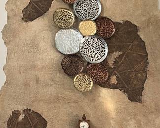 Clock and metal artwork 