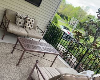 Outdoor couches with pillows and table 