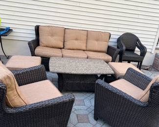 Outdoor couch and chairs and table 