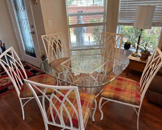 Glass table top dining room table with 5 chairs