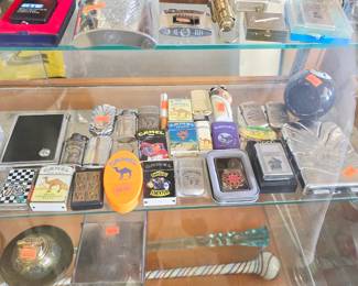 Vintage Camel lighters including zippos, cases, and ashtrays