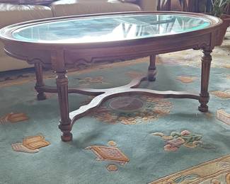 Carved Wood Oval Coffee Table with Glass Top second image