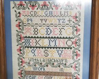 Framed cross-stitch panel