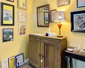 Primitive Oak 2 door farm cabinet Antique Oak and Lead glass mirror Bohemian Brown glass lamp Misc framed Antique Sheet music