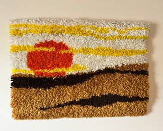 a few 1970's hook rug wall art