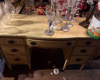 this desk is in the attic and matches the bedroom furniture in the room to your left as you come up to the second floor.  