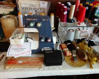 a "Like New" White Serger w/ Instruction Book, Tools and Cover