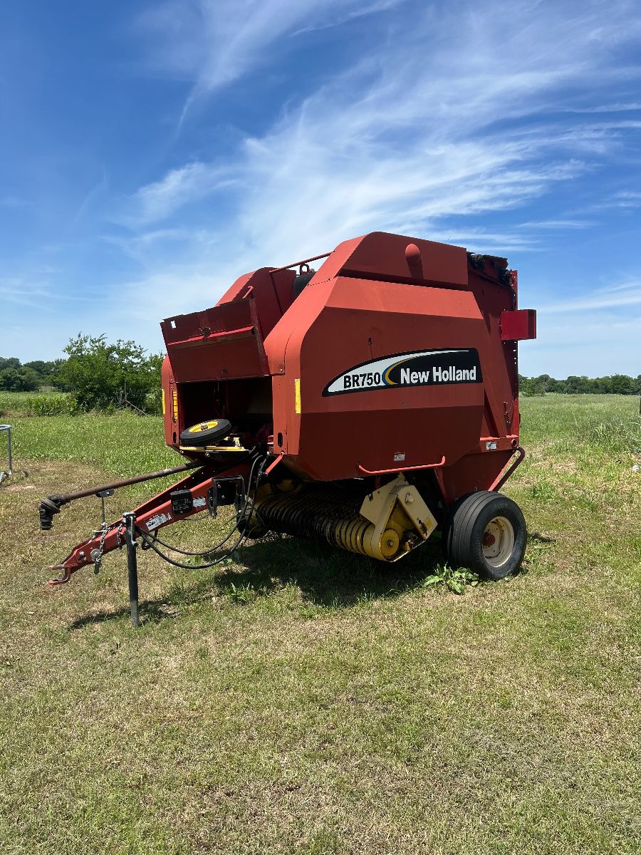 This is a New Holland BR750 Round Baler, designed for large round bales.