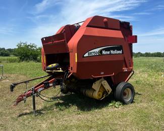 This is a New Holland BR750 Round Baler, designed for large round bales.